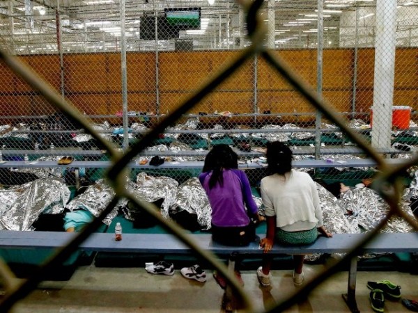 Two young girls at the U.S. Customs and Border Protection Nogales Placement Center. Photo Credit: coolload / Flickr / Creative Commons