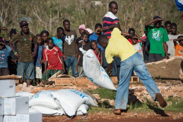 Group of Haitians unpacking supplies