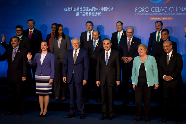 A group of representatives from Latin America and China stand in a group