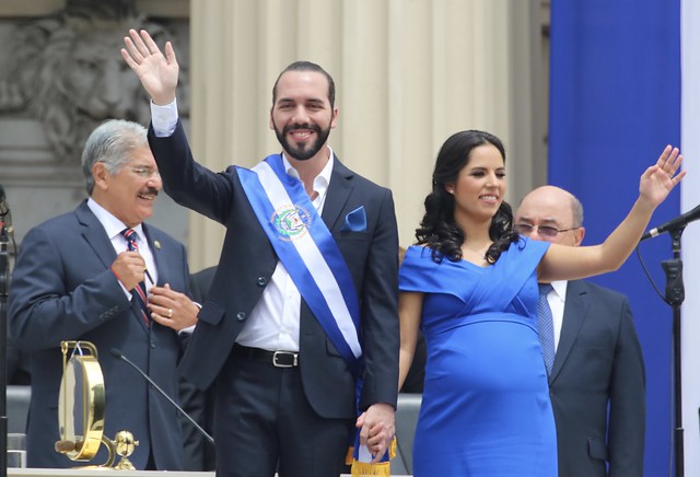President Nayib Bukele and his wife waving to the crowd on his inauguration day