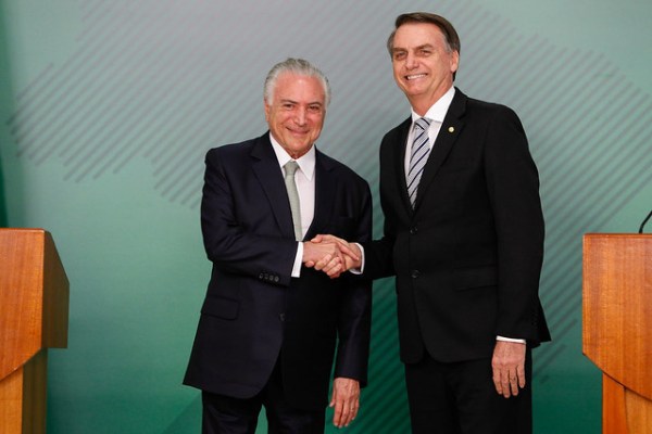 Current Brazilian President Jair Bolsonaro shaking hands with former President Michel Temer